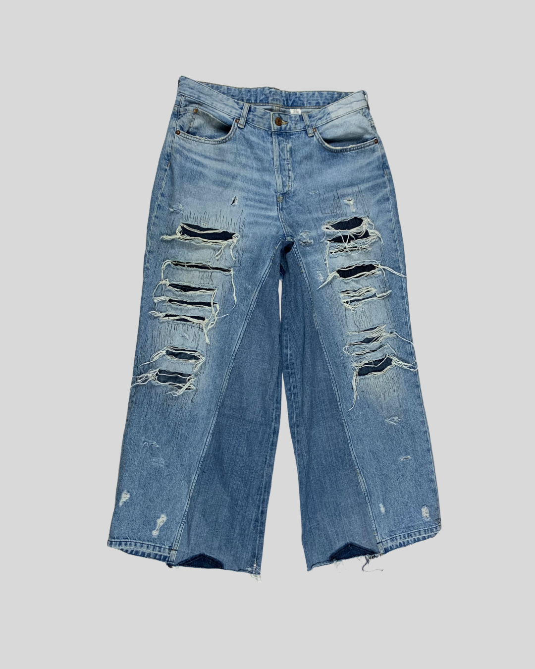 ripped denim cross stitched